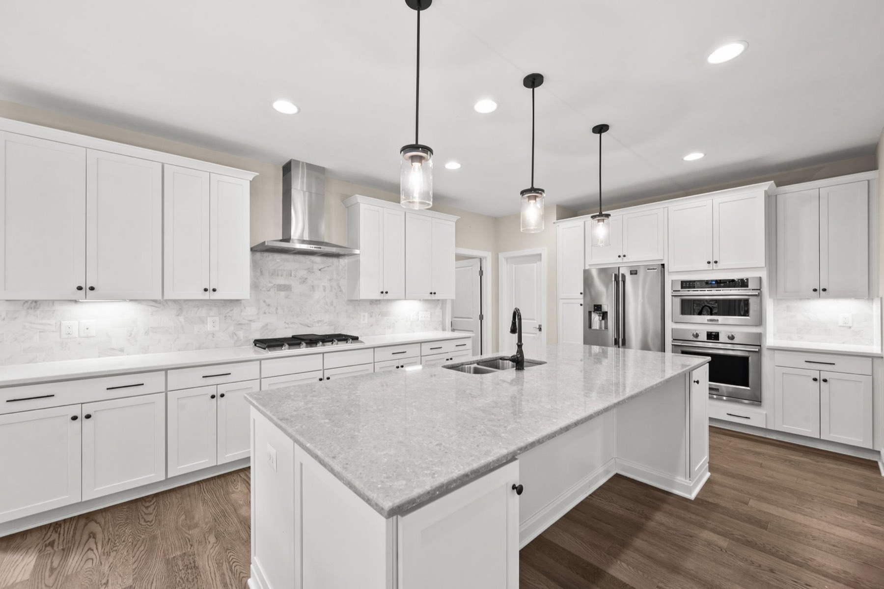 Gourmet kitchen with an oversized quartz island