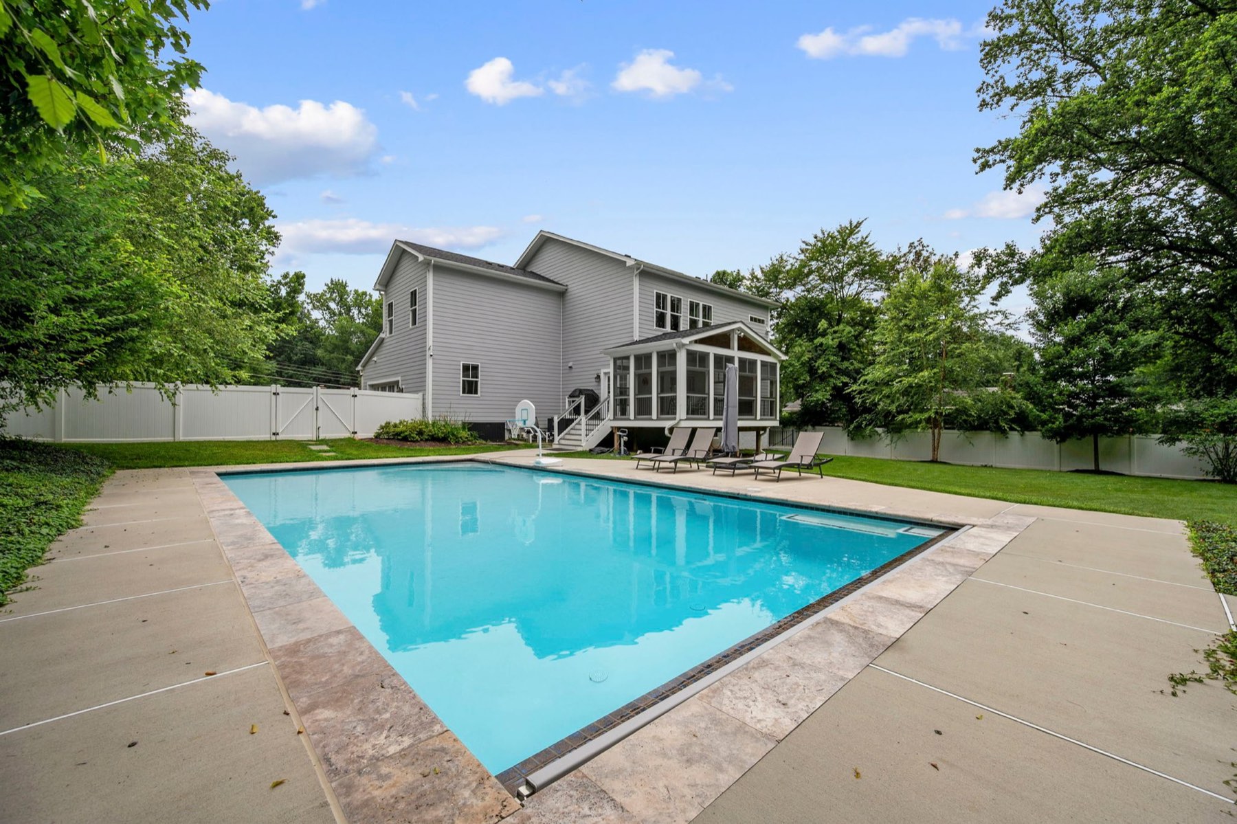 Pool, patio and the rear of the house