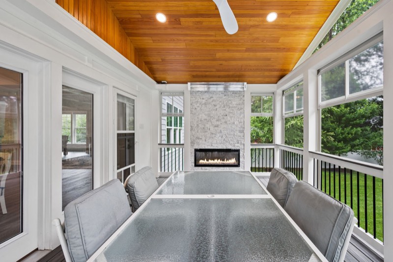 Screened porch with a linear fireplace