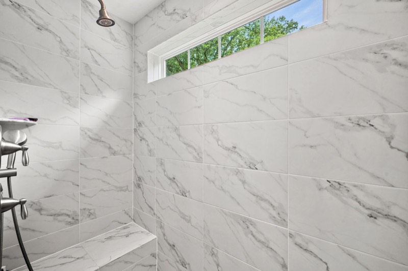 Walk-in shower with designer tile