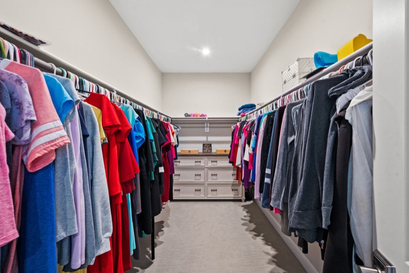 One of the two walk-in closets