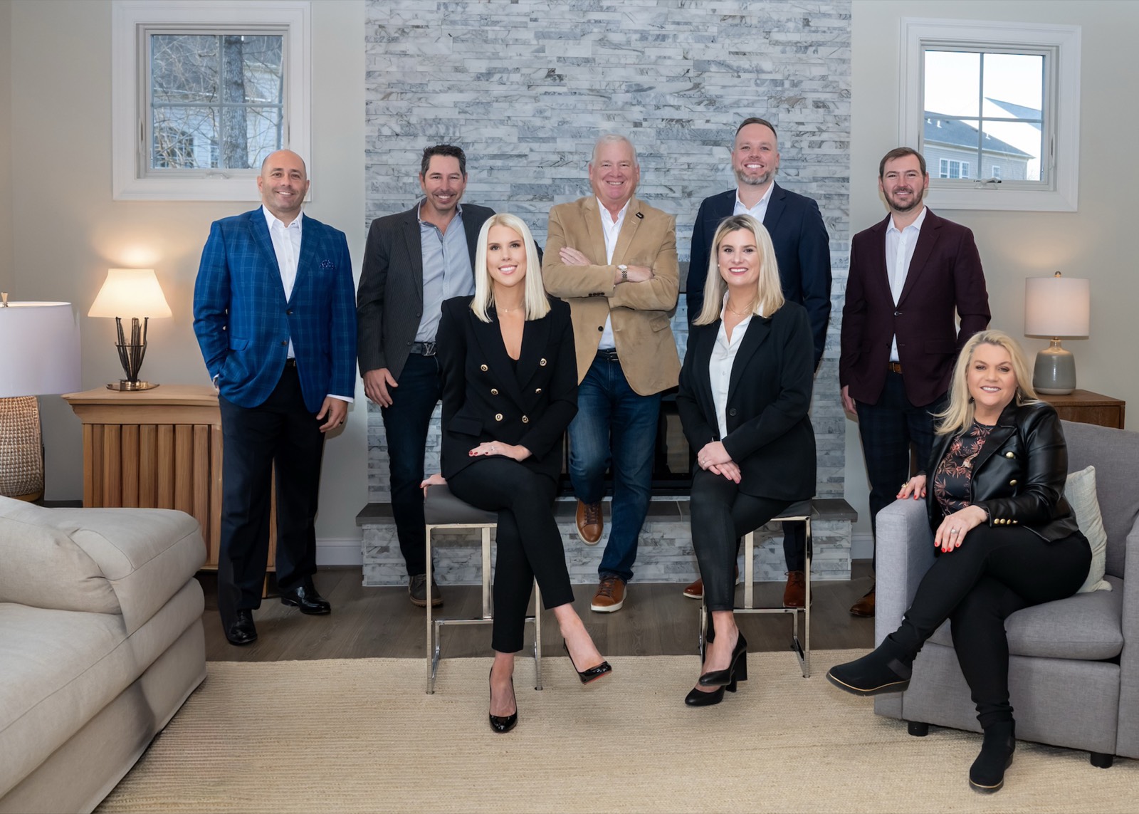 The Casey Samson Team, photographed together in a living room